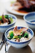 Braised knuckle of pork with bok choy and rice