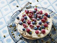 A pistachio cake with fresh berries