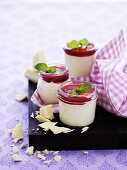 Panna cotta with white chocolate, raspberry sauce and pepper mint leaves