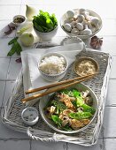 Sesame chicken with mange tout, a mushroom sauce and a side of rice (Asia)