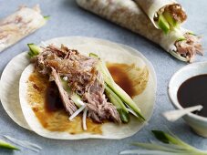 Chinese pancakes with duck, cucumber and plum sauce