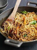 Fried noodles and vegetables in a wok