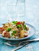 Pork stew with tomatoes, onions, mushrooms, cream and curry served with rice