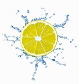 A slice of lemon with a splash of water
