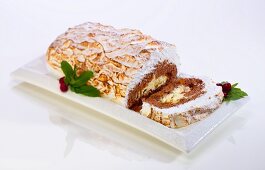 A Christmas Yule log cake with a meringue topping