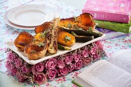 Baked courgettes, butternut squash and root vegetables with thyme and rosemary for Valentine's Day