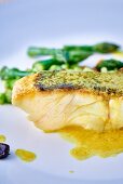 Seabass fillet with butter sauce and black garlic