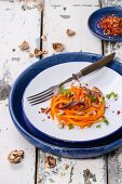 Carrots and vegetable noodles with anchovies, walnuts and parsley