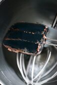 A used spatula and a whisk (close-up)