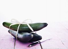 Three cucumbers tied together