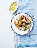 Sate skewers with grilled aubergines and courgettes
