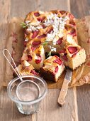 Yeast cake with apples, strawberries and apple blossom