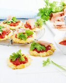 Mini cauliflower pizzas with tomato sauce and parsley
