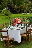 A summery table laid in a garden