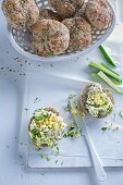 Herb bread rolls topped with chopped egg salad