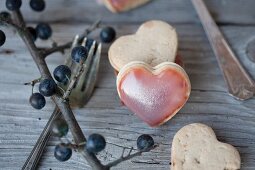 Butter sandwich biscuits filled with sloe jelly topped with sloe juice icing