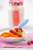 Yoghurt with apricots, raspberries and wild strawberries