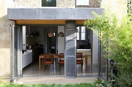 View of dining area through open folding doors