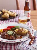 Rump steak with herb butter, fried vegetables and baked potatoes (USA)