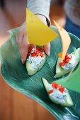 Cucumber boats with herb cream cheese and tomatoes