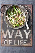 Grilled green asparagus with feta cheese and balsamic vinegar