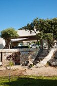 Stone stairs leading to Mediterranean stone house