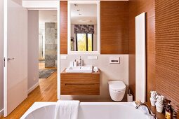 Designer-style, wood-clad ensuite bathroom