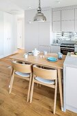 Bright, open-plan fitted kitchen with integrated dining area