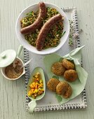 Lentil and parsley falafel with the raw mango chutney, roasted Merguez sausage with wild garlic mustard and a mung bean salad