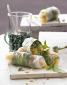 Summer rolls filled with mango, cucumber and wasabi nuts