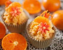 Mandarin cupcakes decorated with sugar flowers