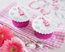 Cupcakes decorated with pink guitars