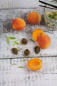 Apricots with stones and verbena, brown sugar and vanilla pods