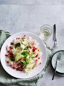 Pink snapper carpaccio with fennel, pomegranate seeds and mint