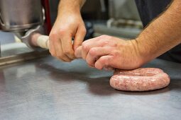 Sausages being made