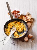 Classic scrambled eggs with bacon and toast