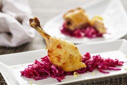 A chicken leg with red cabbage