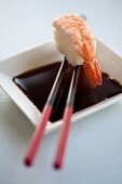 Soy sauce with a prawn nigiri sushi