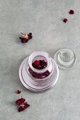Dried rose petals in a medicine jar