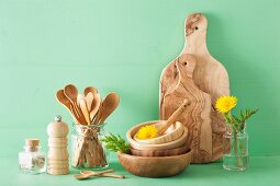 Wooden kitchenware and dandelion flowers