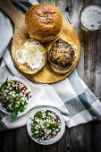 Healthy homemade burgers with vegetable salad and beer