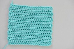 A crochet gauge: rows of half double crochet