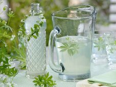 Lemonade with woodruff and a wreath around a bottle