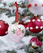 Vintage-style, hand-painted and decorated red and pink Christmas tree baubles