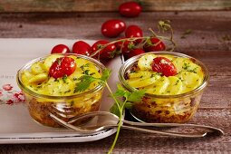 White cabbage and potato bakes with cherry tomatoes