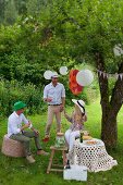 Guests with drinks at garden party