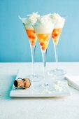 Melon balls in champagne with white chocolate curls