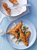 Chicken goujons with a coconut and sesame seed coating and a pasta salad