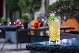 A ginger cocktail on a patio table (Buddha-Bar Hotel, Paris)