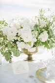 Bouquet of white flowers on outdoor wedding table (Ravello, Italy)